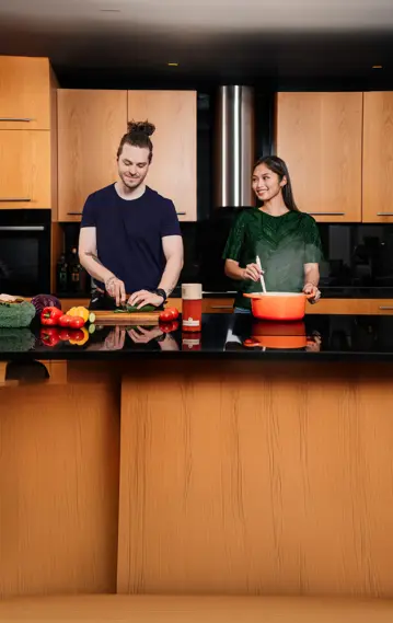 A couple cooking in a kitchen