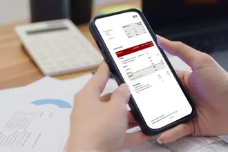 A photo of a mobile phone with a payslip displayed.